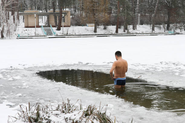 istock Bathing in the ice-hole in  Epiphany Day. 915071198