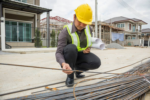 istock professional engineer worker at the house building construction site 915071306