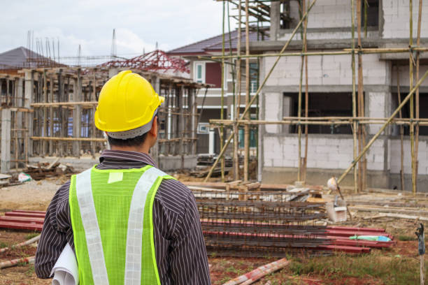 istock Asian business man construction engineer worker at house building site 915071318