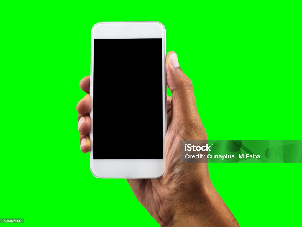 black hand with chrome key Hand holding mobile smart phone with blank screen, isolated cutout on green background with chroma key Telephone Stock Photo