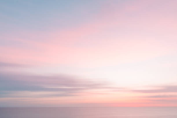 istock Defocused sunrise sky and ocean nature background with blurred panning motion. 915074752