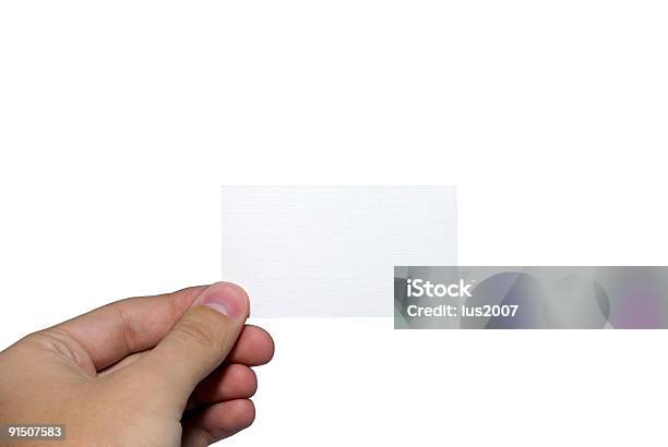 Mano Humana Sosteniendo Vacío Tarjeta De Visita Foto de stock y más banco de imágenes de Agarrar - Agarrar, Anuncio, Blanco - Color