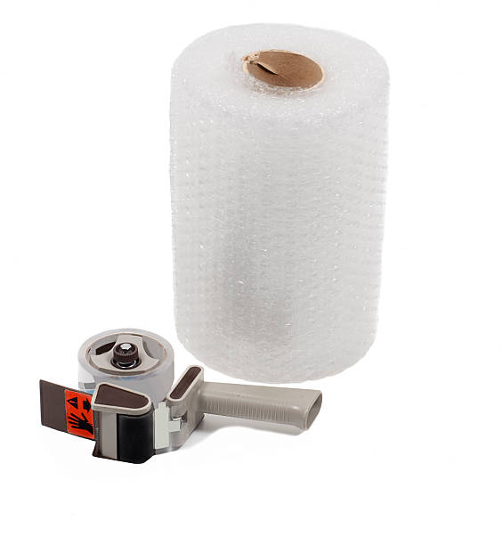 Roll of bubble wrap with tape dispenser stock photo