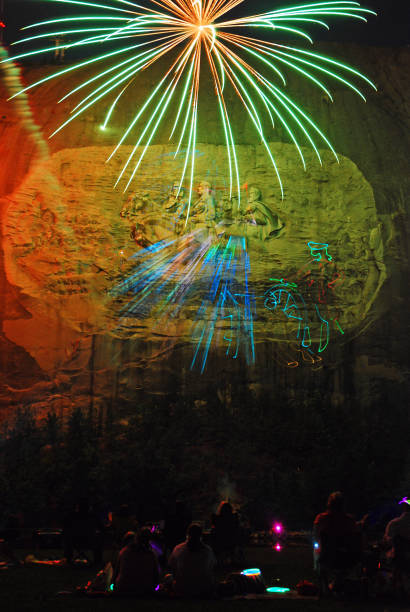 fireworks over stone mountain - laser firework display performance showing imagens e fotografias de stock