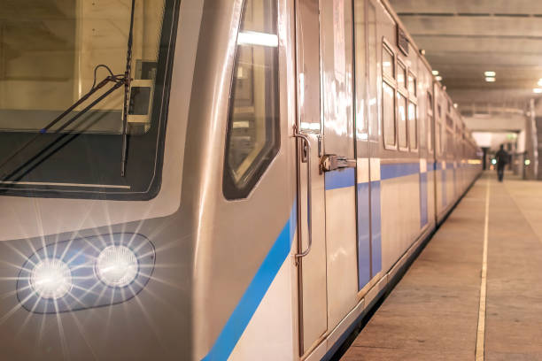 istock the train stopped at the metro station platform with lights on 915082580