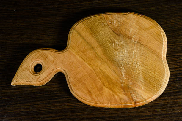 istock Cutting board on the dark wooden table. Top view 915082908