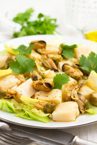 istock salad with seafood on white plate 915083326