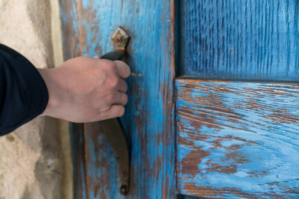 hand hold handle of door, close up
