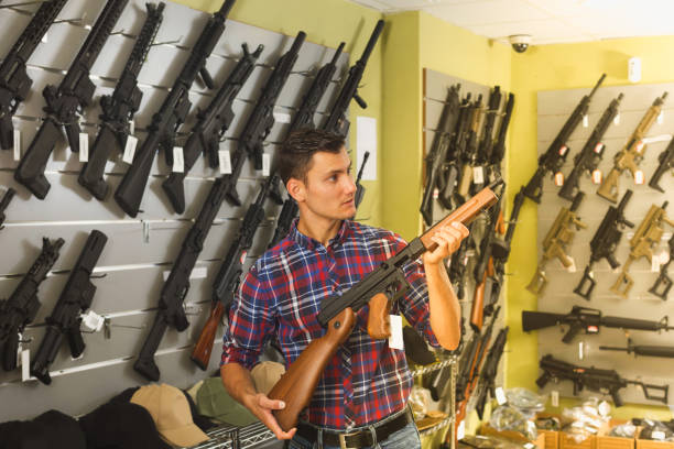 istock Man buying air weapon 915086690