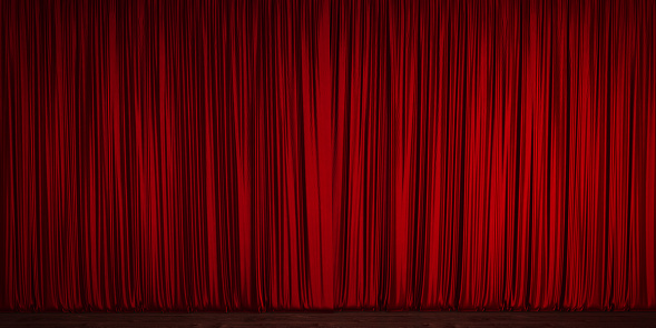 Red velvet theater curtain. Red velvet curtain is contacting wood ground. Panoramic composition.