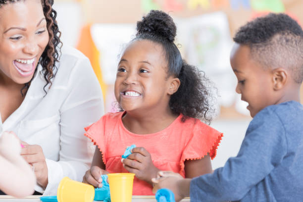 istock Happy little girl playing with modeling clay 915093562
