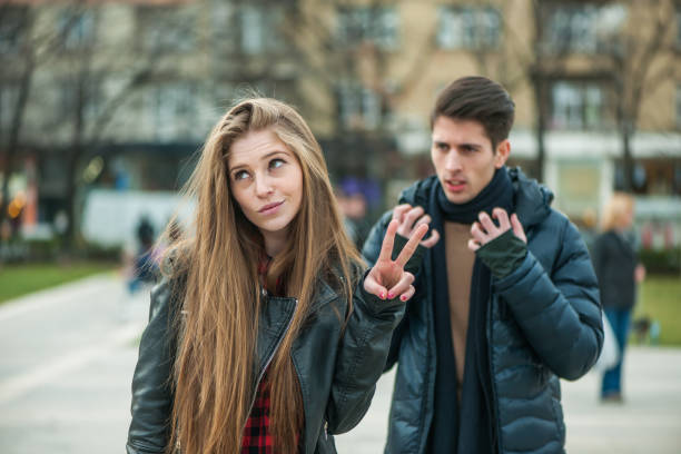 istock Young couple arguing at the street 915094612