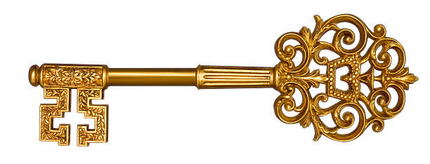 декоративные золотой ключ на белом - skeleton key стоковые фото и изображения