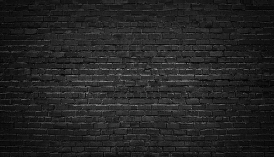 black brick wall background. texture dark masonry