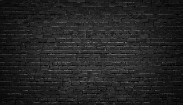 Photo of black brick wall background. texture dark masonry