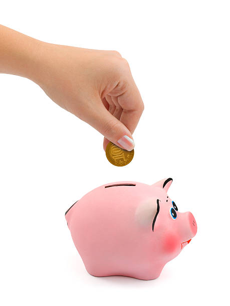 istock Piggy bank and hand with coin 91509877