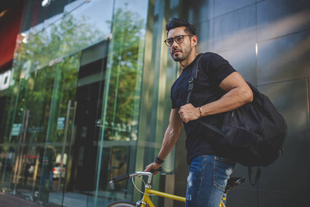 istock Handsome man on bike 915101360