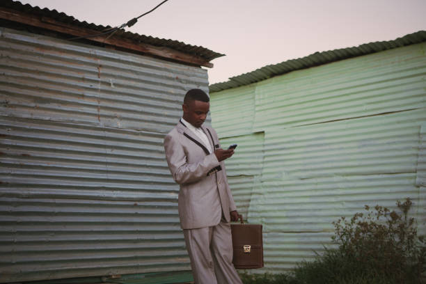 istock Black business man working on his phone 915101362
