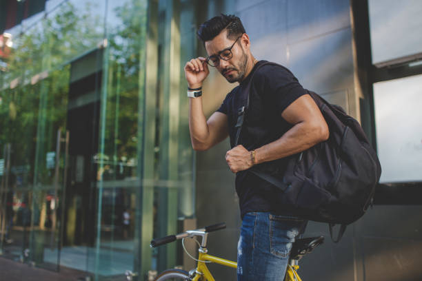 istock Charming man riding a bike 915101432