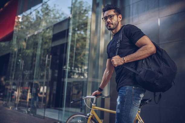 istock Handsome man on bike downtown 915101928
