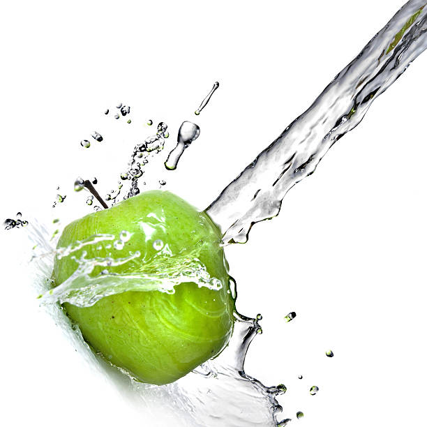 istock fresh water splash and green apple isolated on white 91510293
