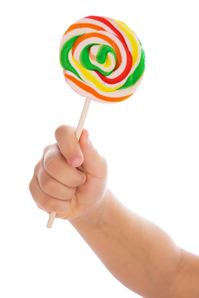 istock Color lollipop in child hand 91510316