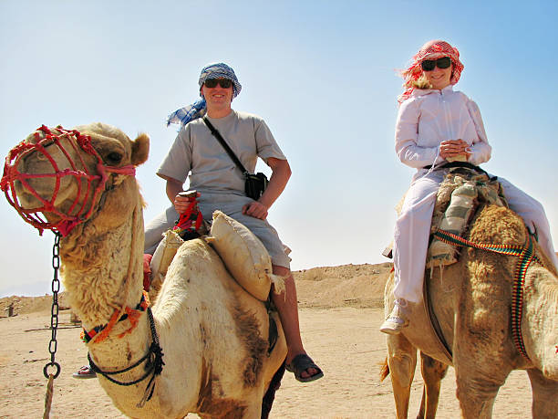 istock people traveling on camels in egypt 91510518