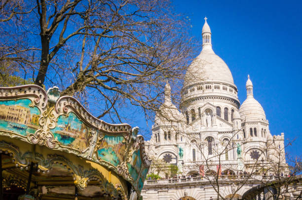 istock Sacre coeur and merry-go-round in Montmartre 915109708