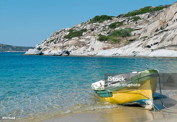 Old Boat On The Beach Greek Mediterranean Stock Photo - Download Image Now - Bay of Water, Beach, Clear Sky