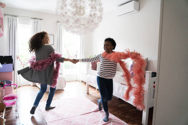 istock Mother and daughter practicing dance at home 915116860