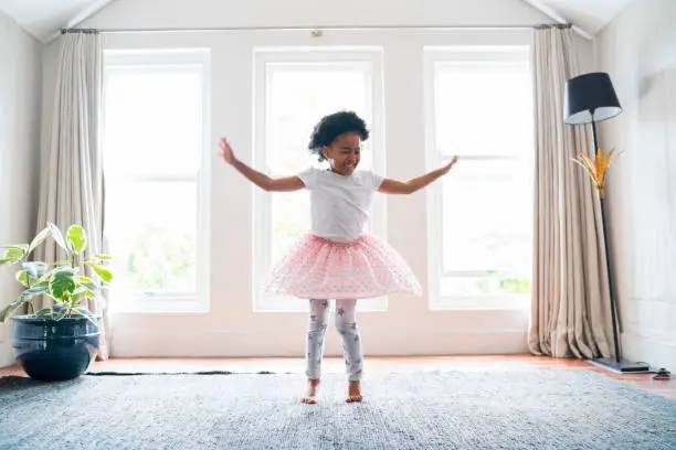 Photo of Girl performing ballet dance at home