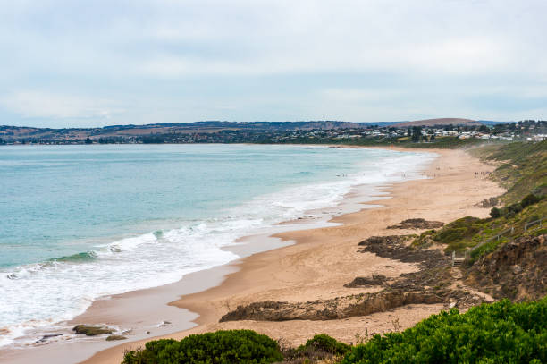 istock Picturesque coastline with sand beach and soft waves 915117860