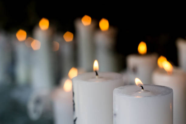 istock white candle light in the dark 915118194