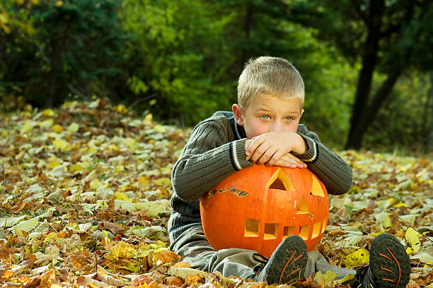 istock Little boy with pumpkin 91511845