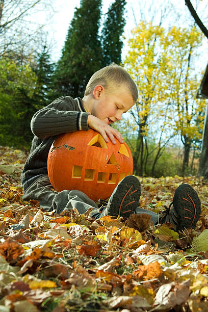 istock Little boy with pumpkin 91511847
