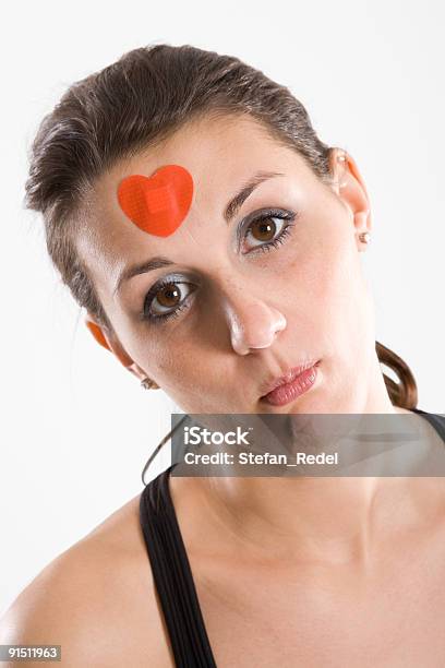 Woman With Red Heart Bandage Stock Photo - Download Image Now - Adhesive Bandage, Adult, Color Image