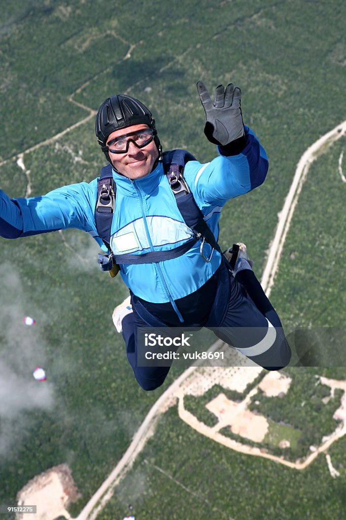 Skydiver in action Skydiver in action-Losinj Island-Croatia Diving Into Water Stock Photo