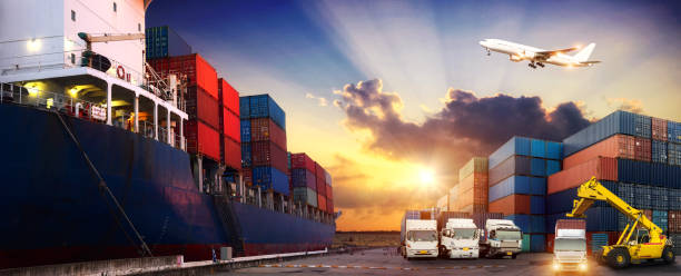 istock Logistics and transportation of Container Cargo ship and Cargo plane with working crane bridge in shipyard at sunrise, logistic import export and transport industry background 915124670