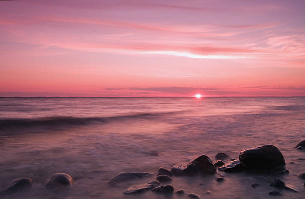 istock Tidewater against beach and rocks at sunset 91512720