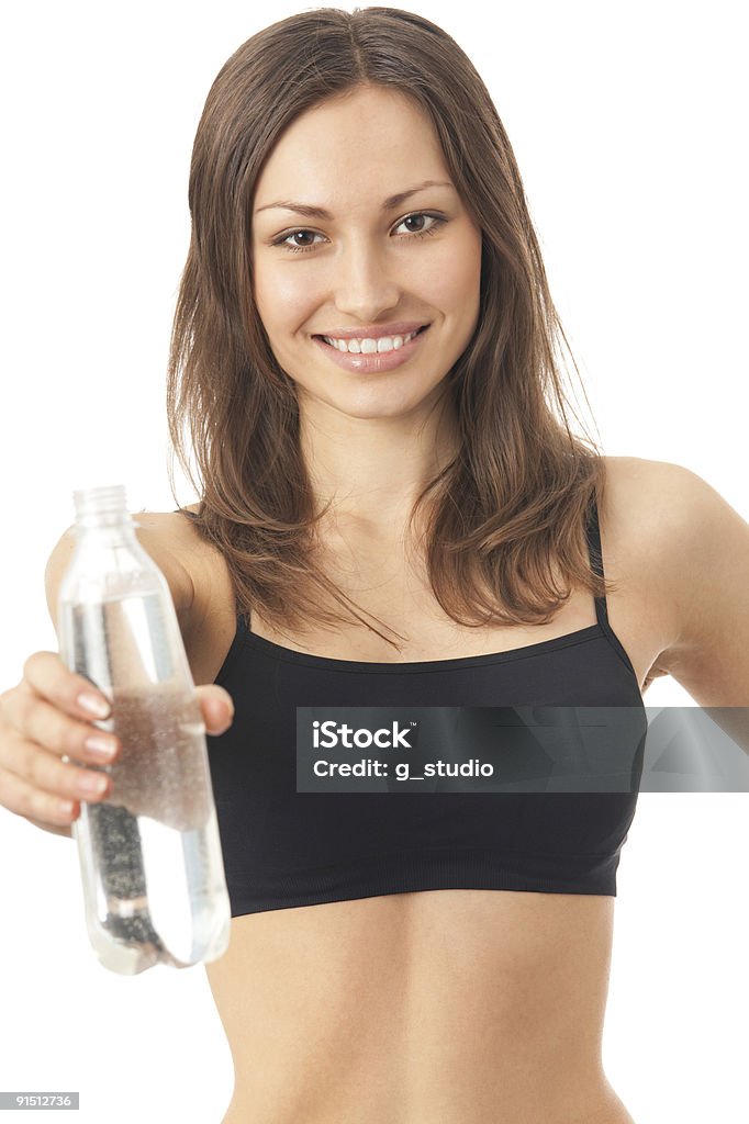 Młody szczęśliwy uśmiech kobieta w odzieży sportowej z wodą, izolowany - Zbiór zdjęć royalty-free (Aerobik)
