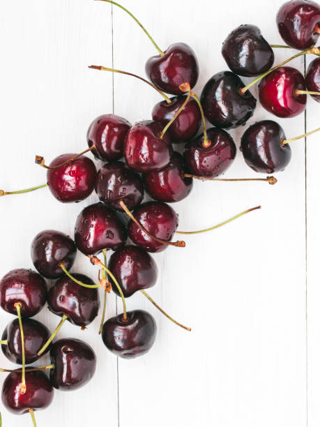 istock Ripe cherry on white wooden table. Top view 915127772