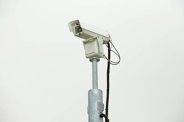 istock Grey security camera surveys the surrounding area. 91512781