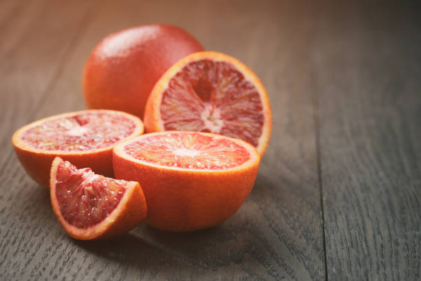 istock red sicilian oranges sliced on wooden table 915128626