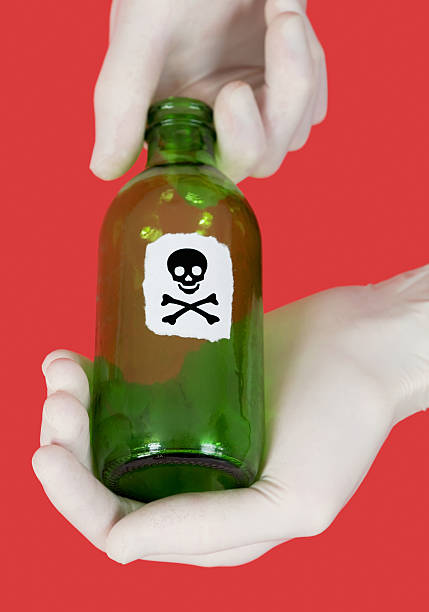 istock Green bottle with skull and crossbones 91513260