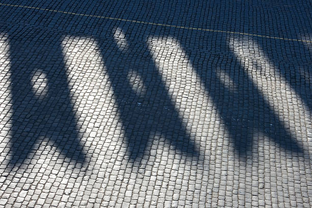 Shadow from kremlin wall on stone blocks, Red square. stock photo