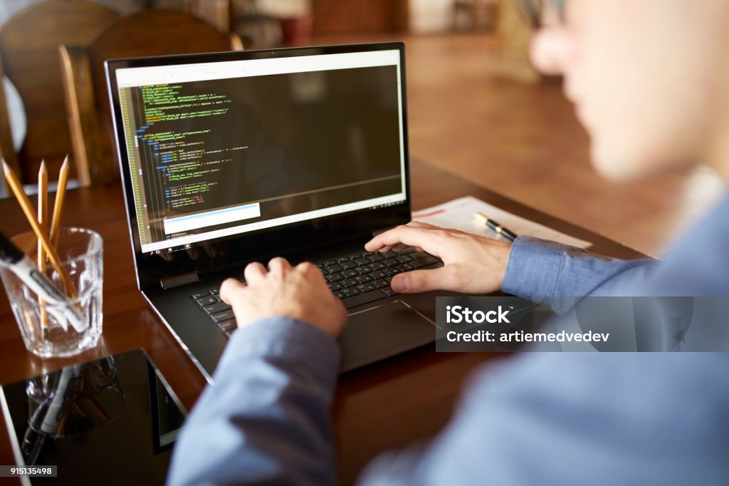 Back View Over The Shoulder Shot Of Developer Programmer With Laptop ...