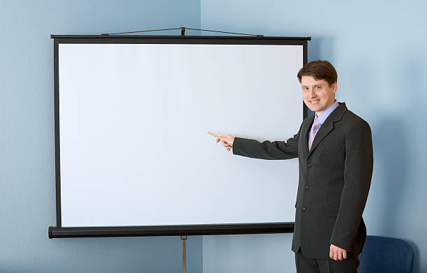 istock Businessman near the white screen 91513638