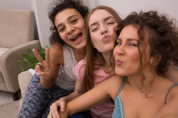 istock Women in pajamas on sofa 915137196