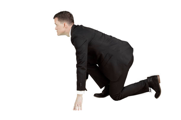 istock European male manager kneeling on studio 915137218