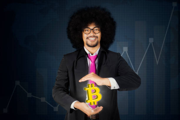 istock Entrepreneur showing bitcoin symbol on his hand 915139388